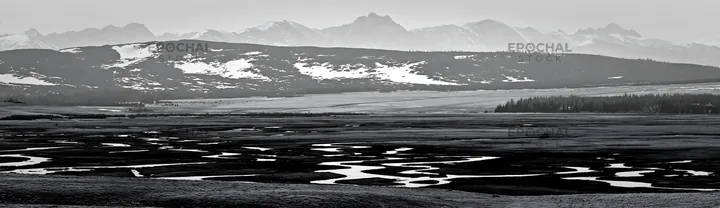 Spring snowmelt in Tatra mountains meadow - AI-generated stock image