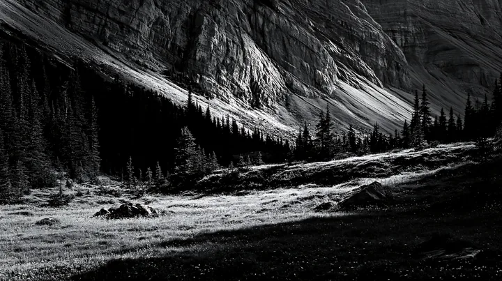 Meadow under crags with trees and mountainous backdrop - AI-generated stock image