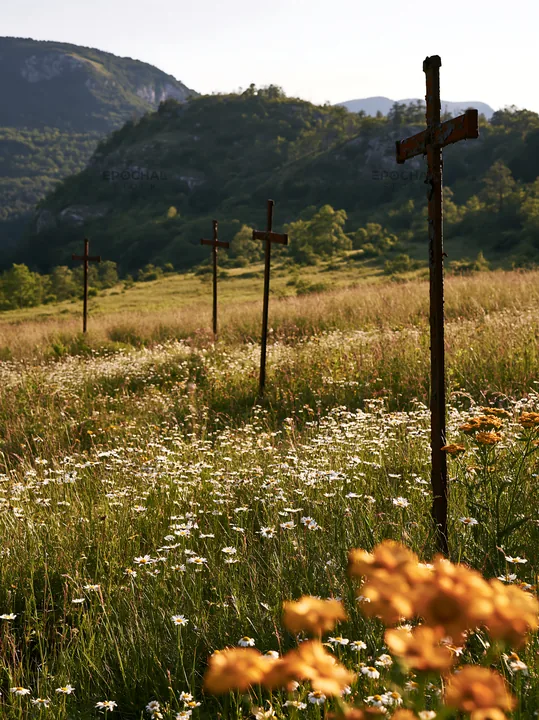 Three iron crosses in an Advent meadow - AI-generated stock image