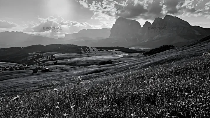 Sunbeams over Alpe di Siusi meadow with mountains in background - AI-generated stock image