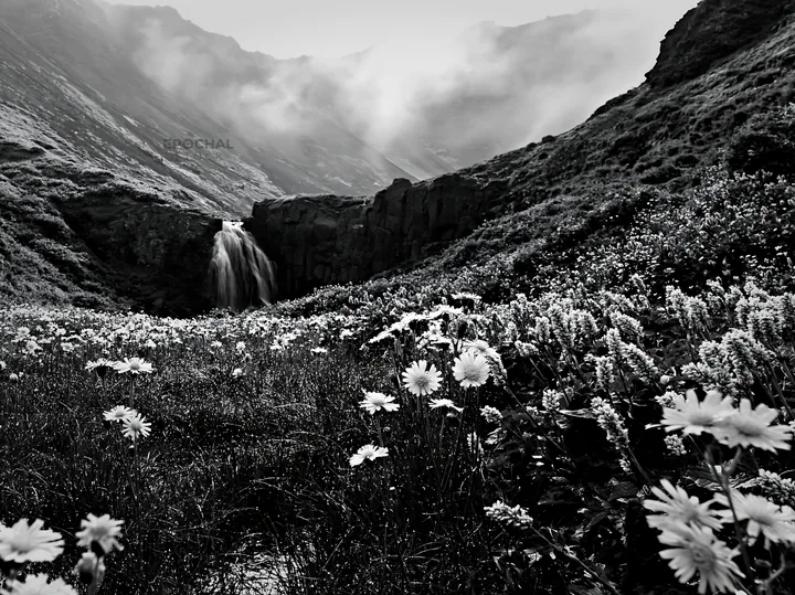 Misty mountain waterfall in meadow with flowers - AI-generated stock image
