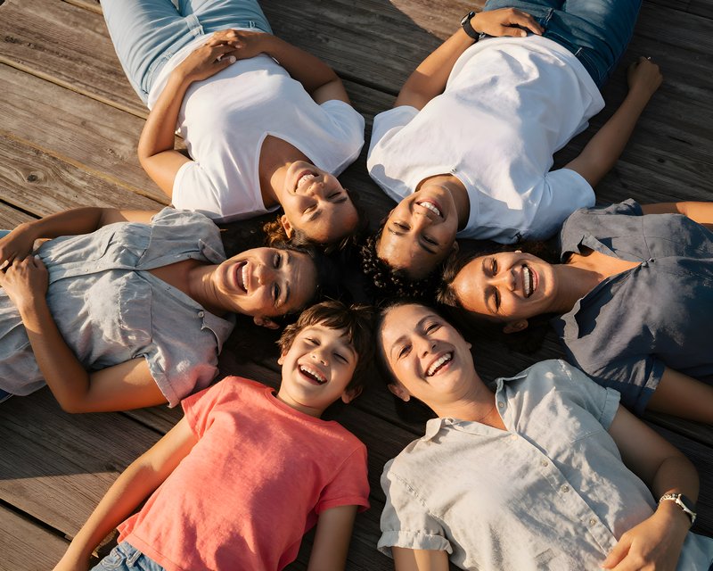 Family and friends enjoy time together on wooden deck Free Premium Stock Photo - stock photo