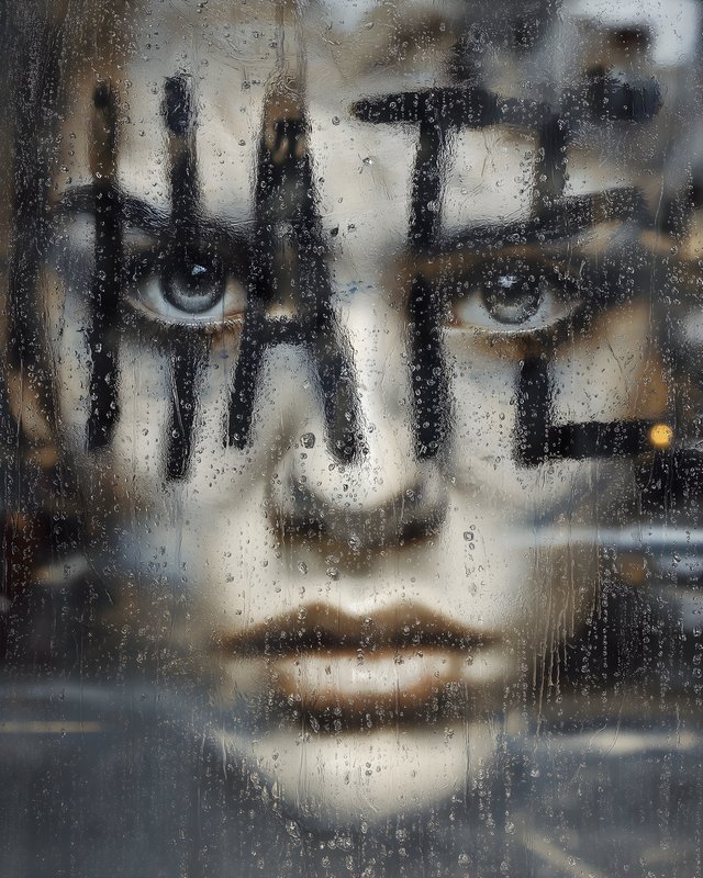 Message written on a window with rain and a face behind Free Premium Stock Photo - stock photo