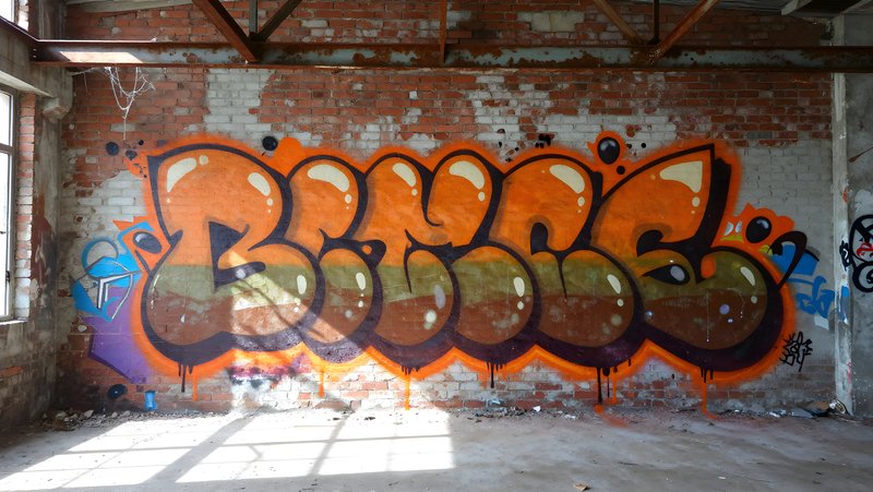 Graffiti art on a brick wall in an old building Free Premium Stock Photo - stock photo