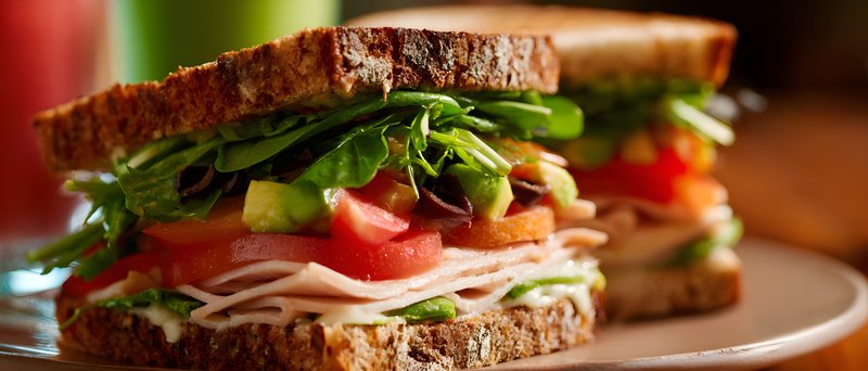 Fresh sandwich with vegetables and turkey on whole grain bread Free Premium Stock Image - stock photo