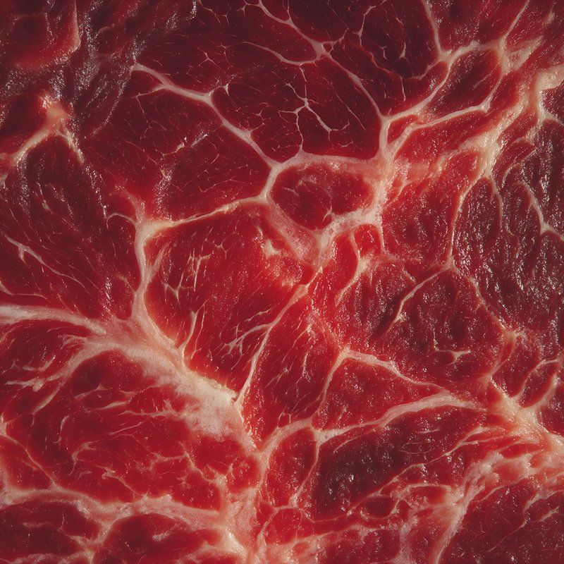 Close view of raw beef showing fat and muscle texture Free Premium Stock Image - stock photo