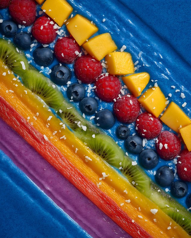 Fruit arrangement on blue plate with colorful layout Free Premium Stock Photo - stock photo
