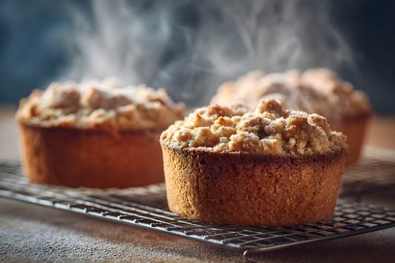 Freshly baked cakes cooling on a wire rack in a kitchen Free Premium Stock Photo - stock photo