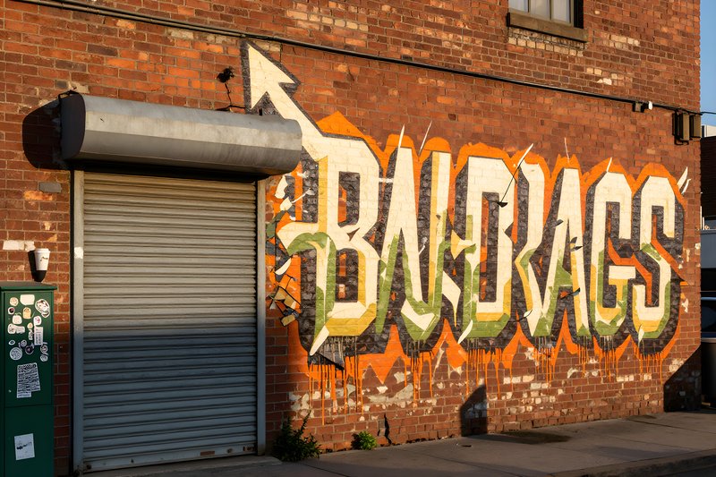 Mural on a brick wall in an urban setting Premium Stock Photo - stock photo