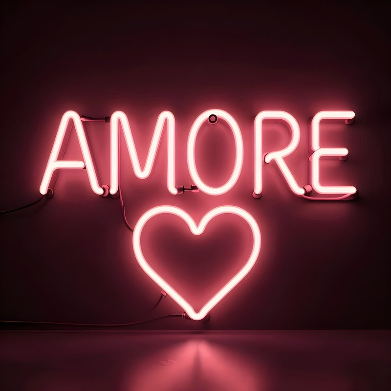 Amore neon sign glowing bright in a dark room setting Premium Stock Image - stock photo