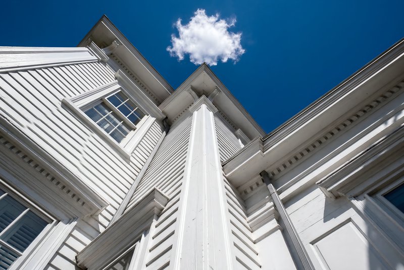 View of a white house against a clear blue sky Premium Stock Image - stock photo