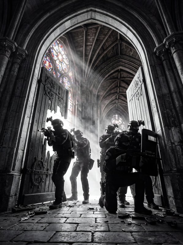 SWAT team enters an old building with guns drawn during mission Premium Stock Image - stock photo