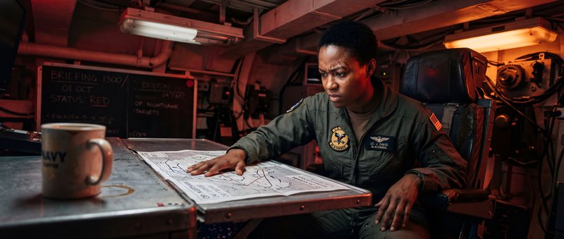 Military personnel studies map in command center at night Premium Stock Image - stock photo