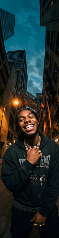 Man smiles in urban alley during evening hours Premium Stock Photo - stock photo