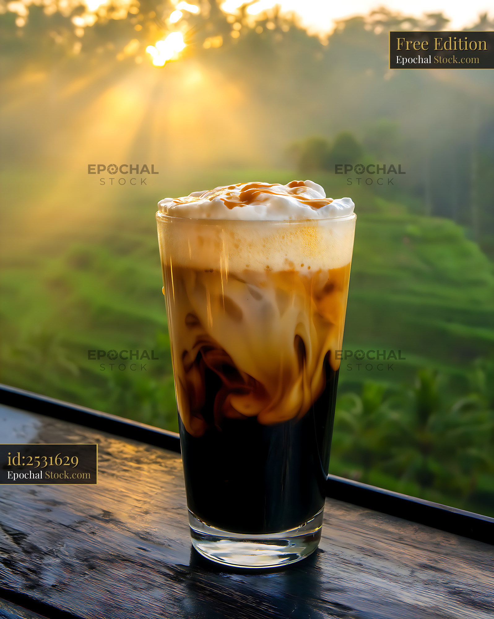 Iced Caramel Coffee Overlooking Sunrise Forest - stock photo