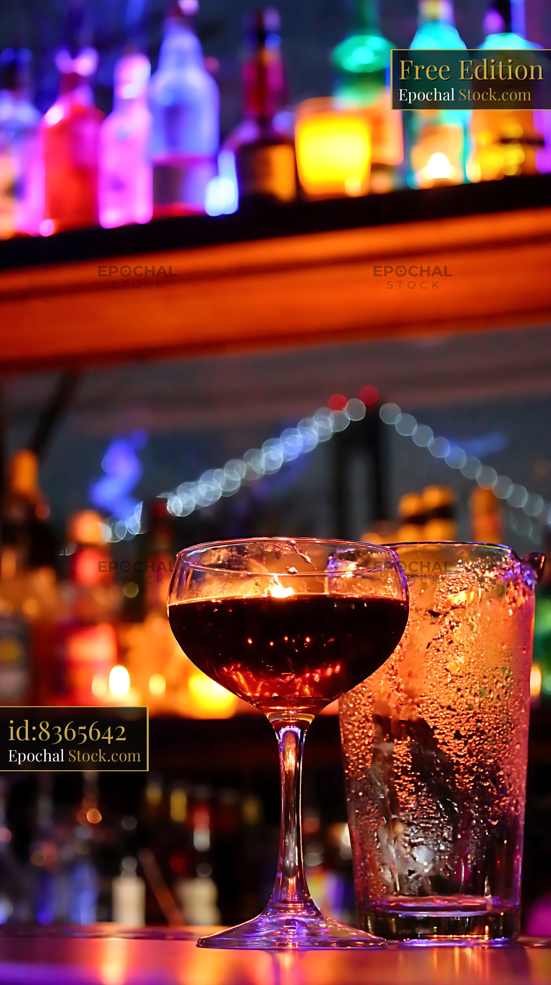 Bushwick Cocktail in Neon Lit Bar Setting - stock photo