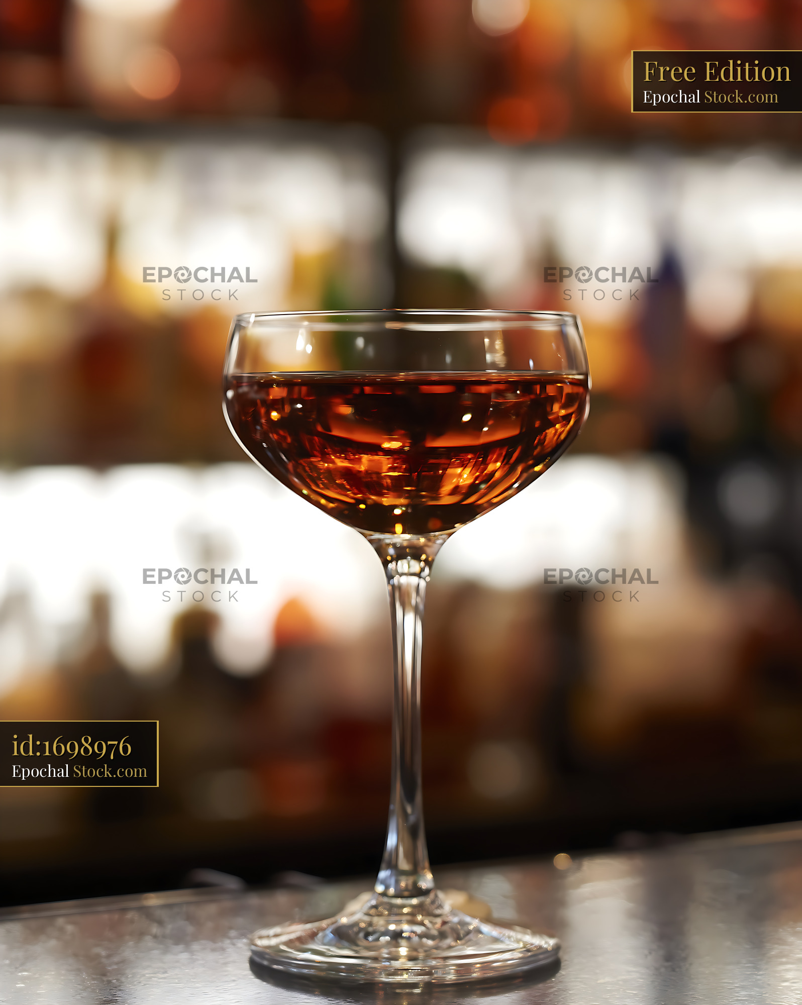 Bushwick Cocktail in Coupe Glass at Bar - stock photo