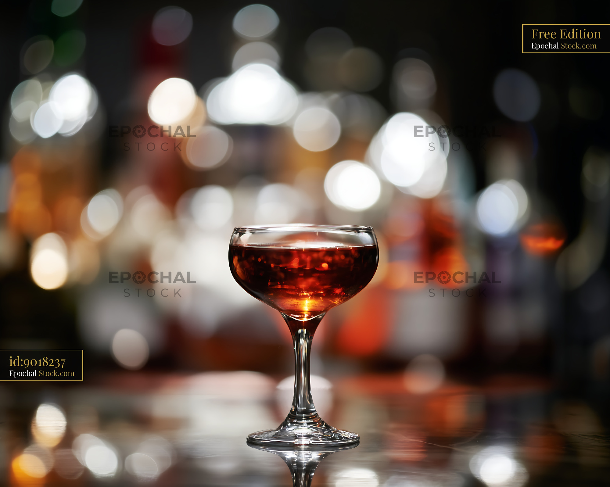 Cocktail in Elegant Coupe Glass with Bar Bokeh - stock photo
