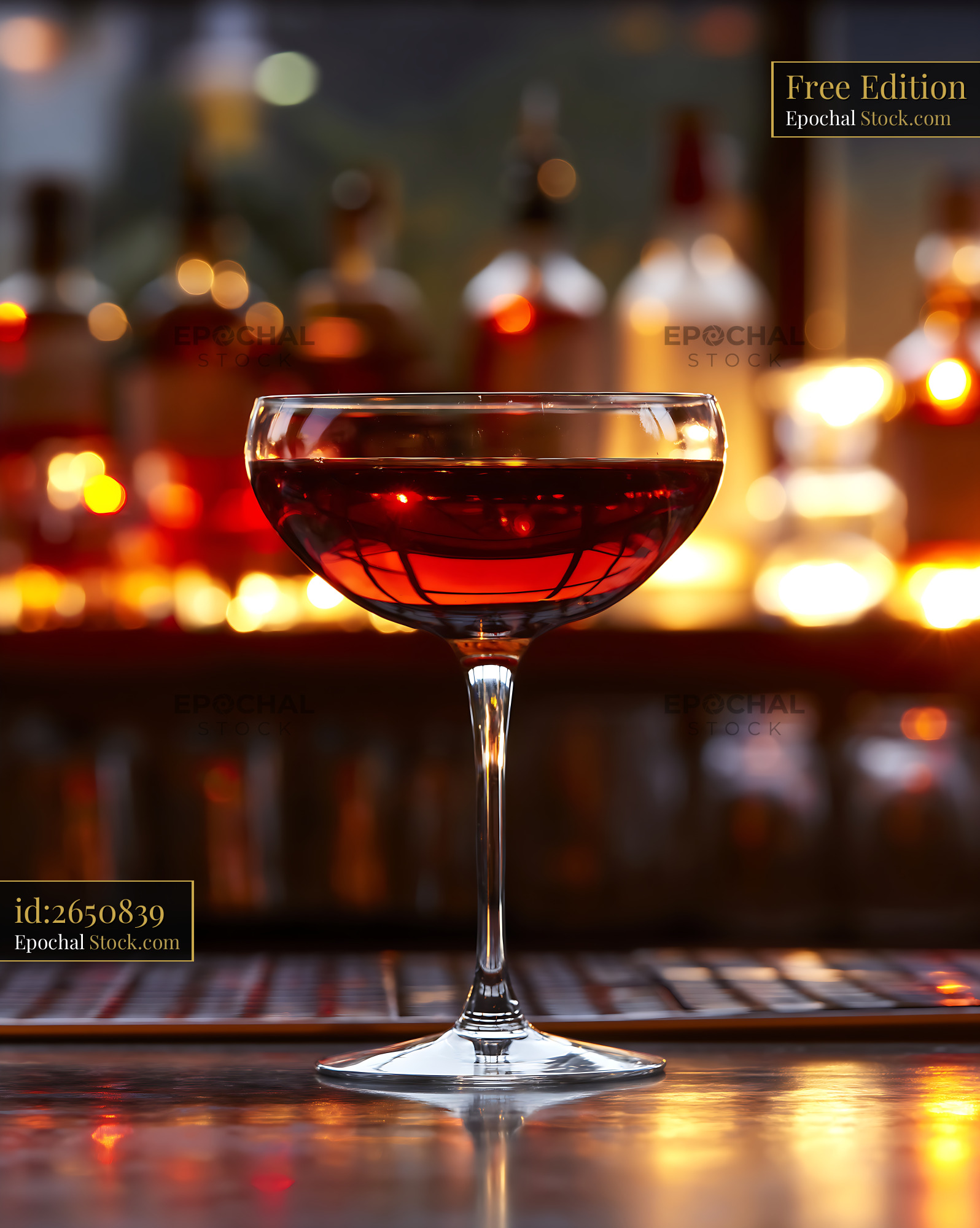 Bushwick Cocktail in Coupe Glass at Bar - stock photo