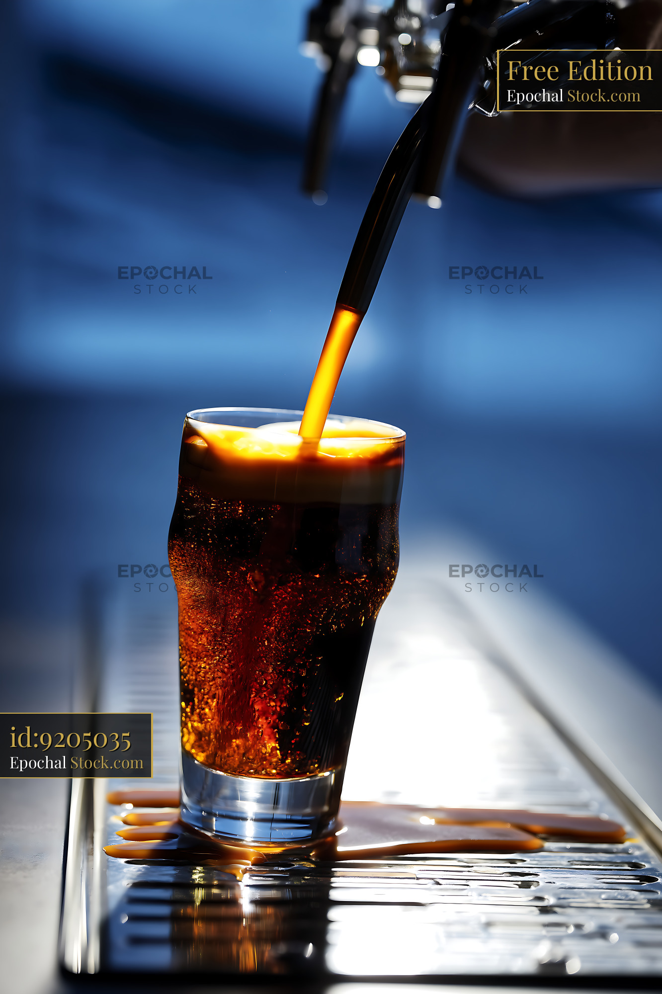 Cold Cola Pouring Into Icy Glass - stock photo