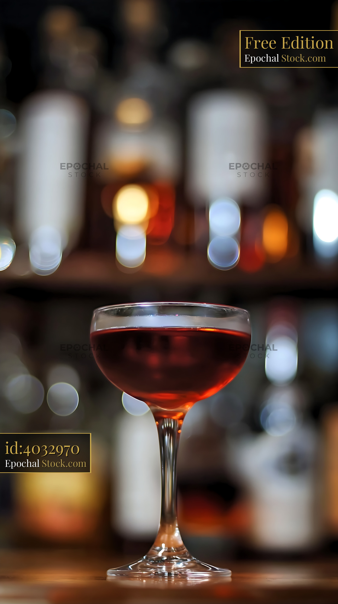 Bushwick Cocktail in Coupe Glass at Bar - stock photo