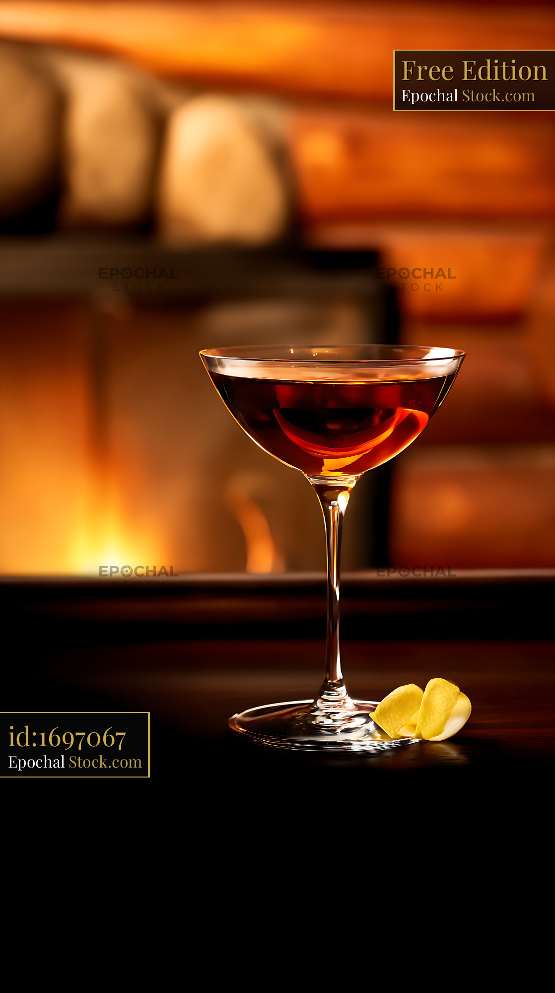 Cognac in Coupe Glass with Lemon Garnish - stock photo