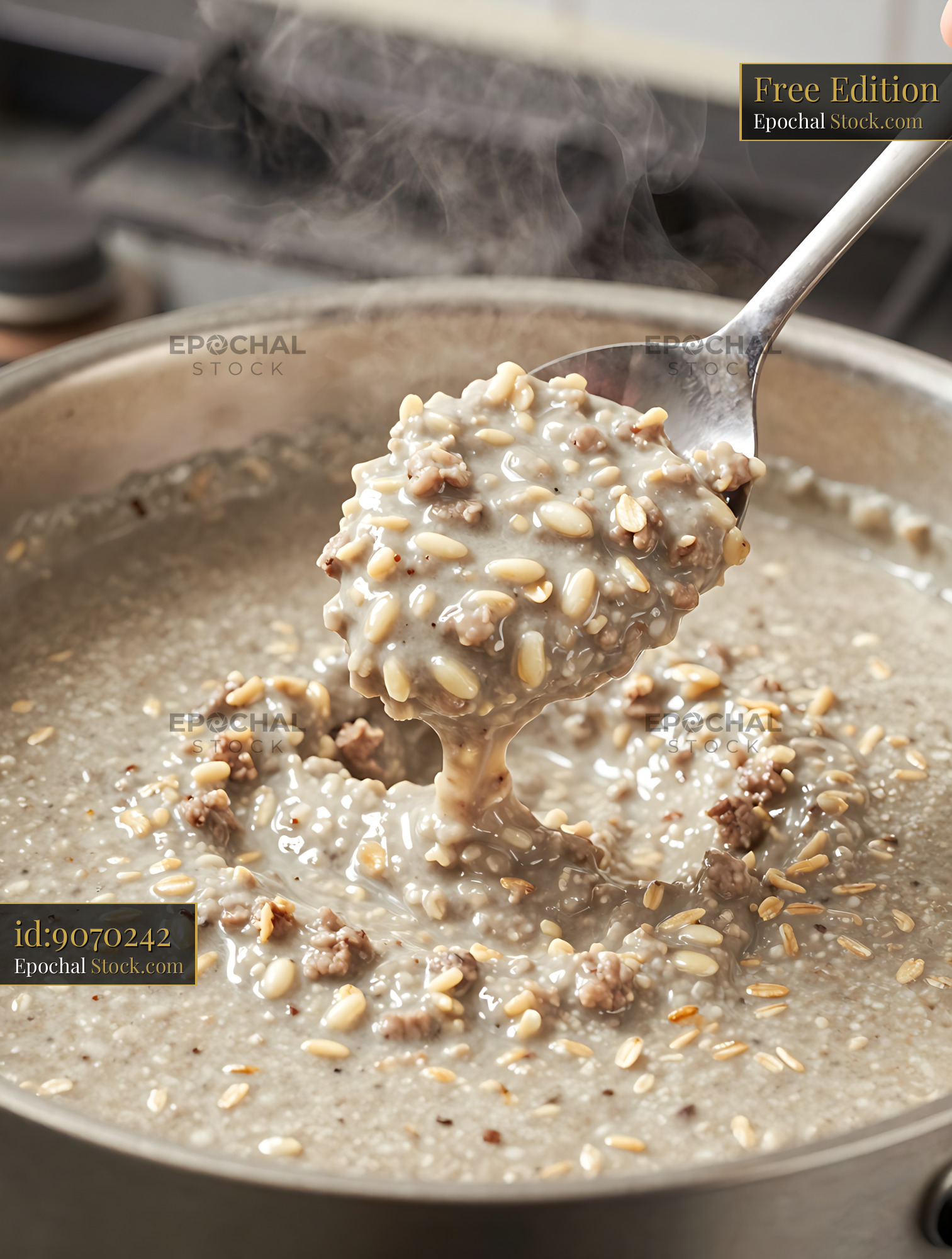 Creamy Oatmeal with Walnuts Cooking on Stove - stock photo