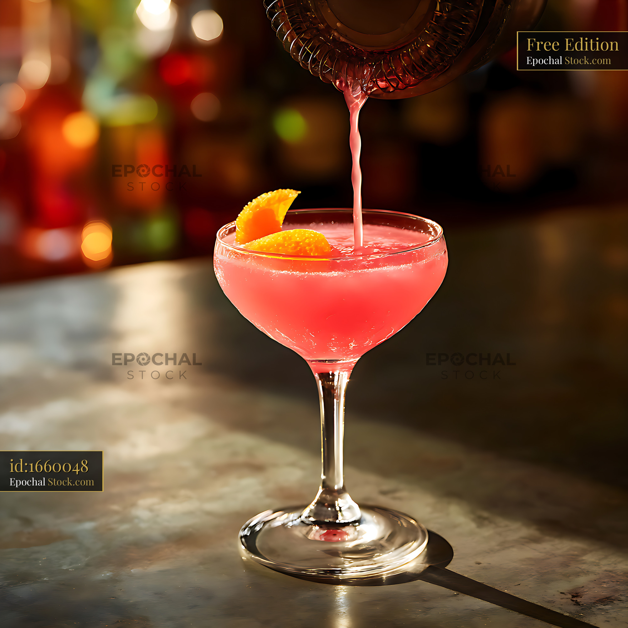 Cosmopolitan Cocktail Pouring into Coupe Glass - stock photo