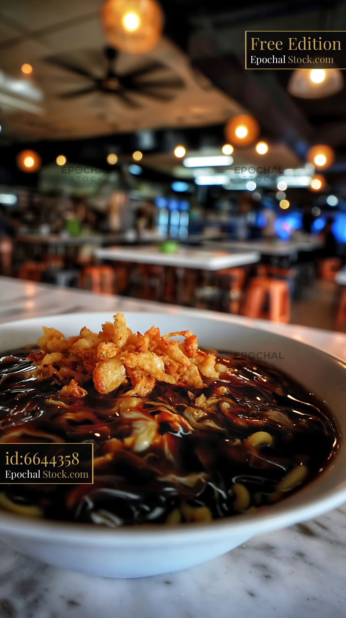 Lor Mee Soup with Crispy Shallots in Restaurant Setting - stock photo