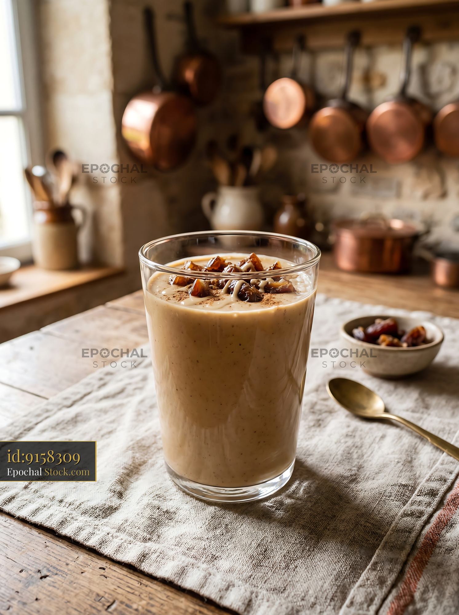 Tahini Date Shake with Nuts on Rustic Table - stock photo