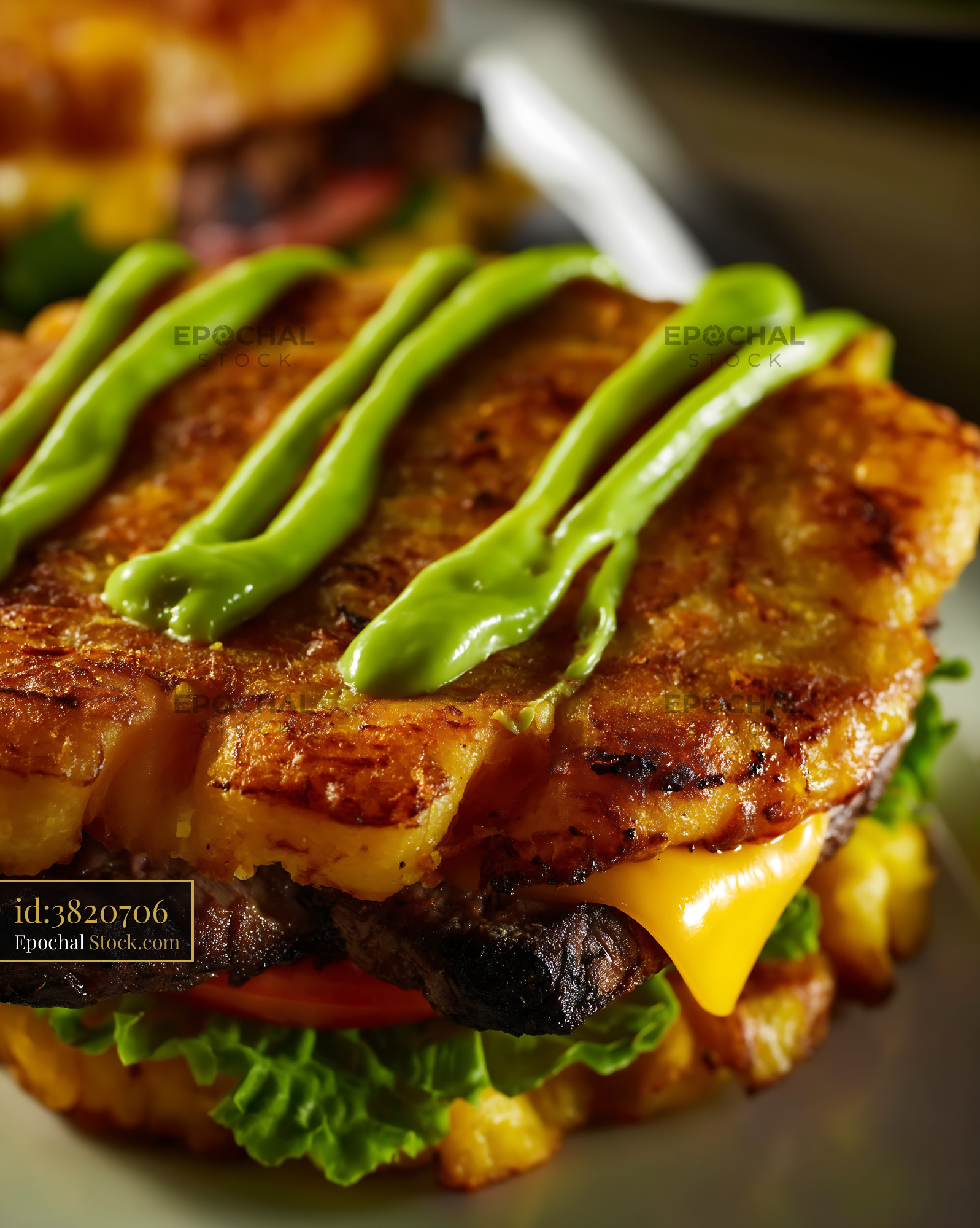 Crispy Golden Jibarito Burger with Plantain Buns and Green Sauce - stock photo