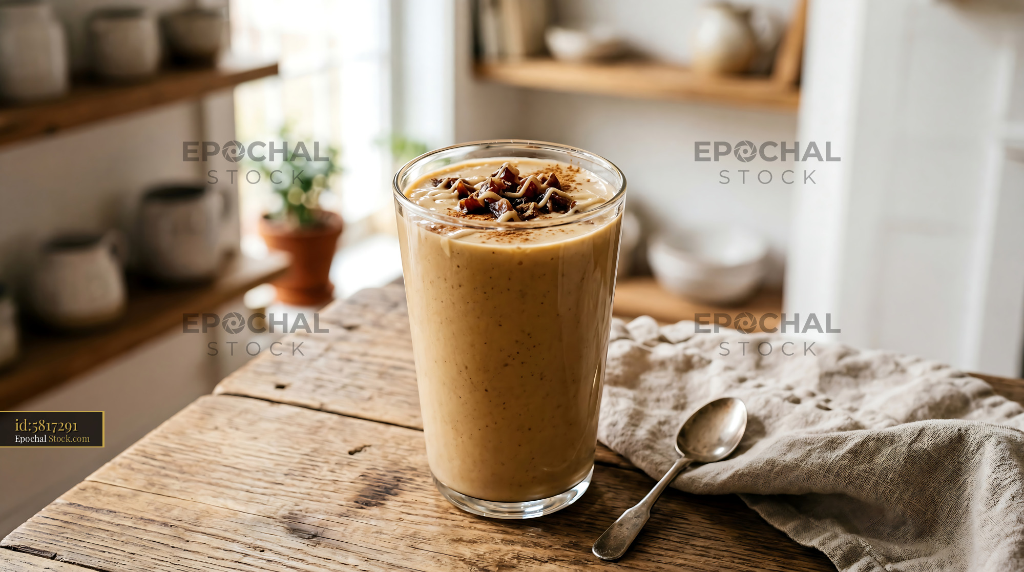 Tahini Date Shake on Wooden Kitchen Table - stock photo
