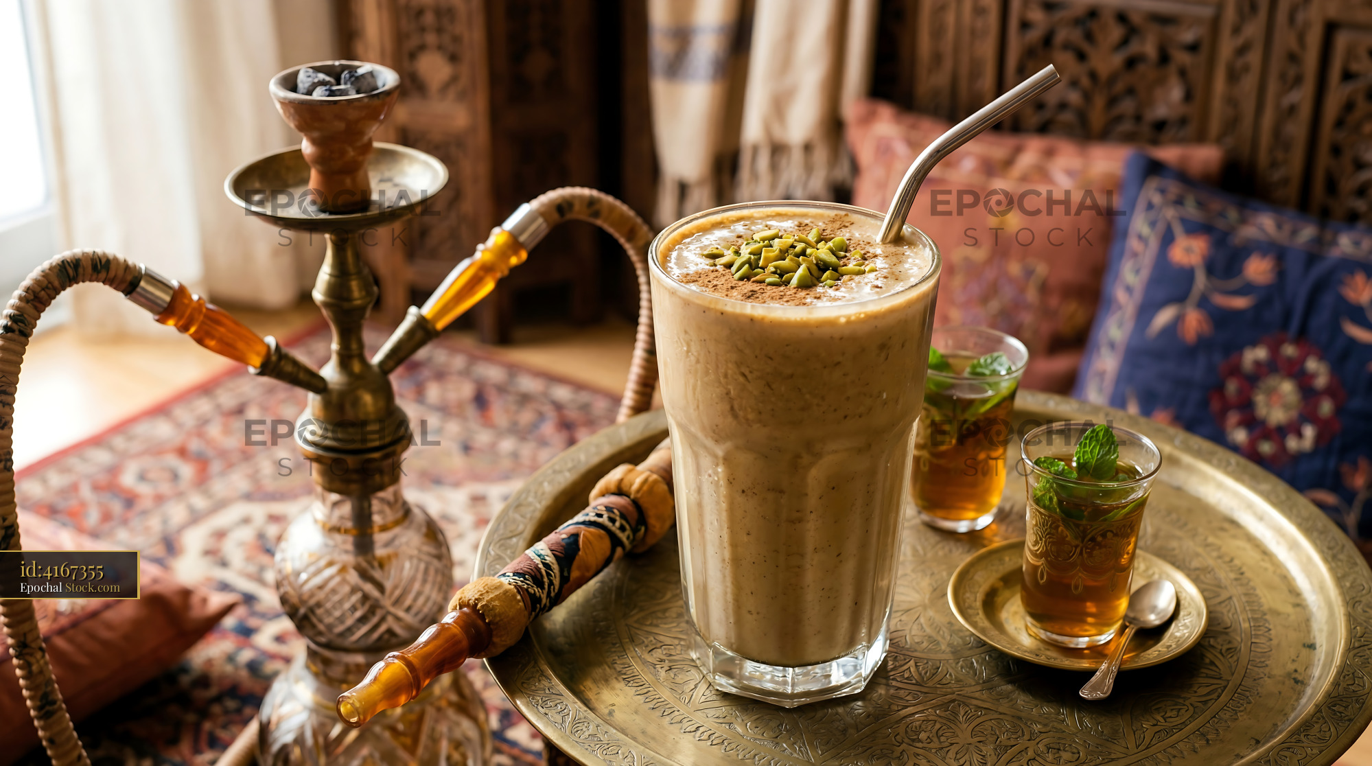 Tahini Date Shake with Pistachio on Brass Tray - stock photo