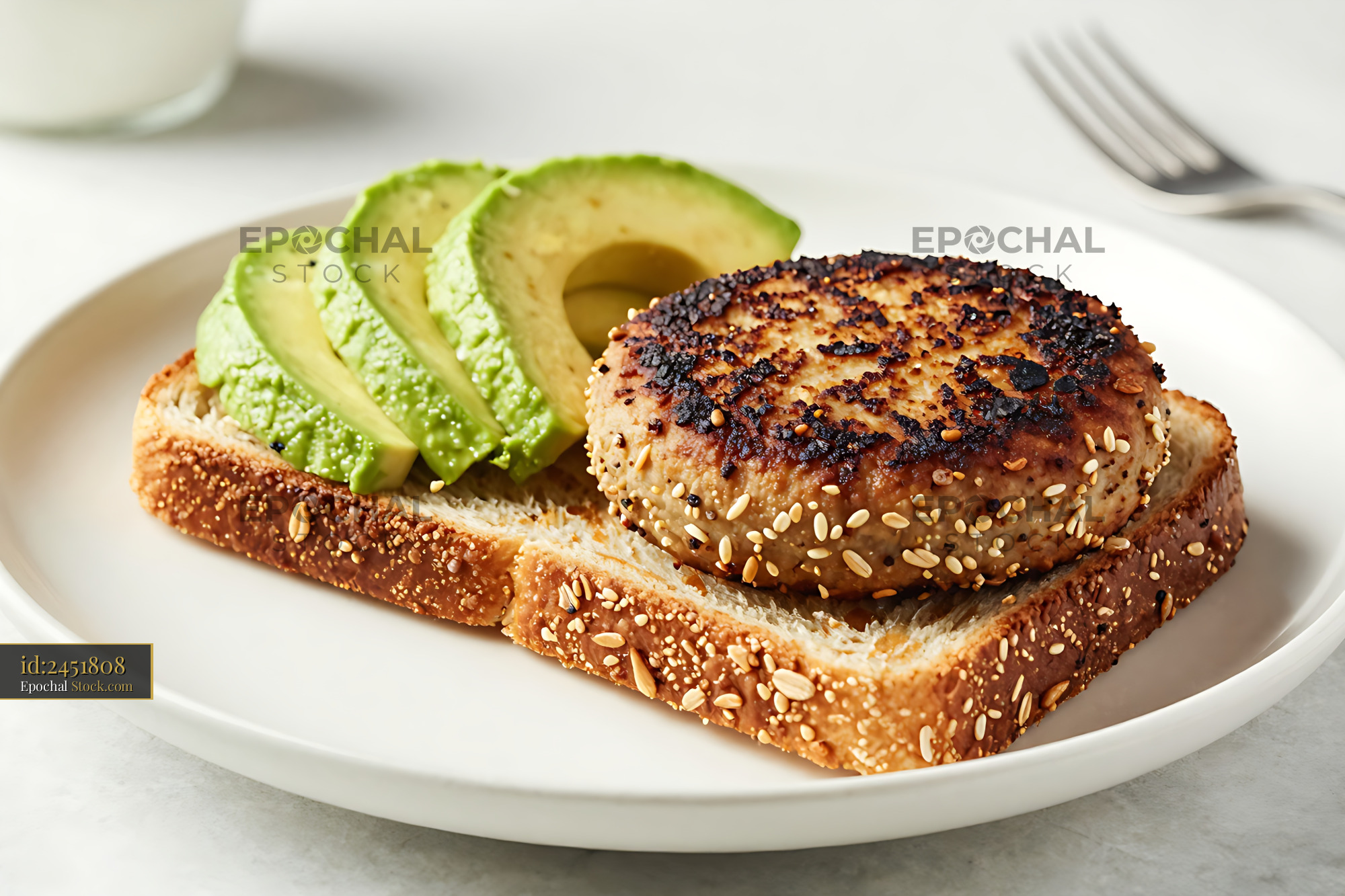 Crispy Goetta Patty on Sesame Seed Toast with Fresh Avocado - stock photo