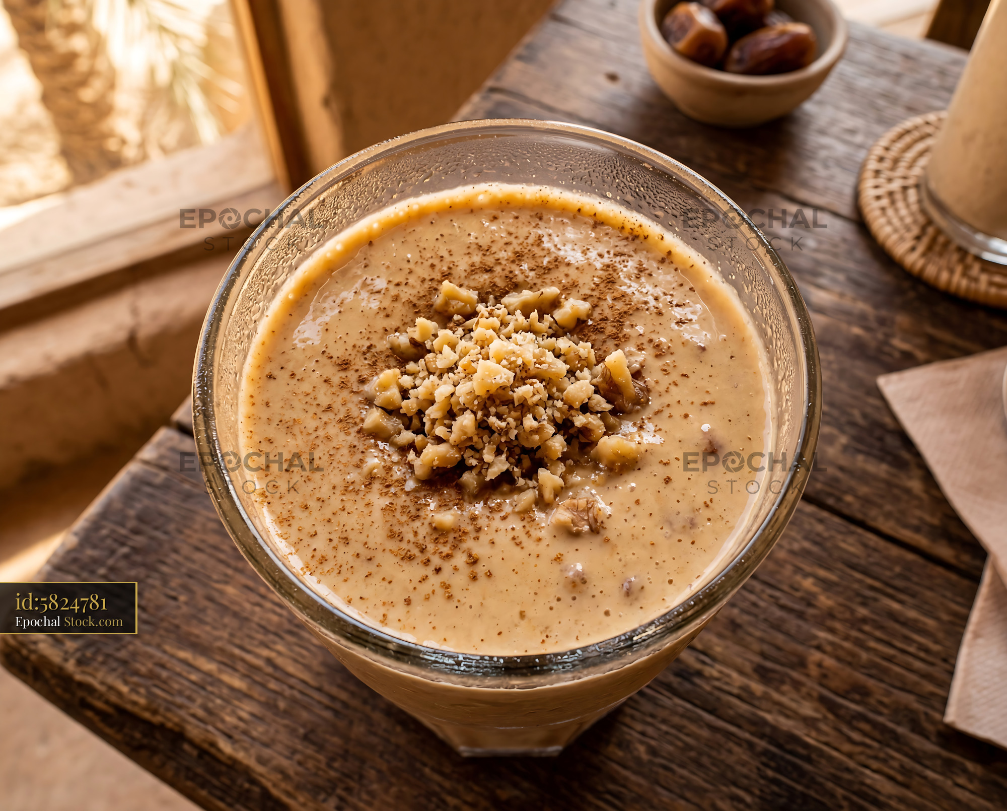 Tahini Date Shake with Chopped Walnuts Garnish - stock photo