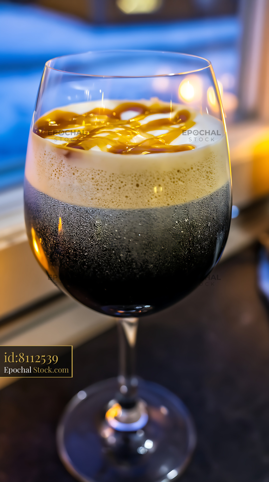 Nitro Caramel Coffee Iced Drink in Wine Glass - stock photo
