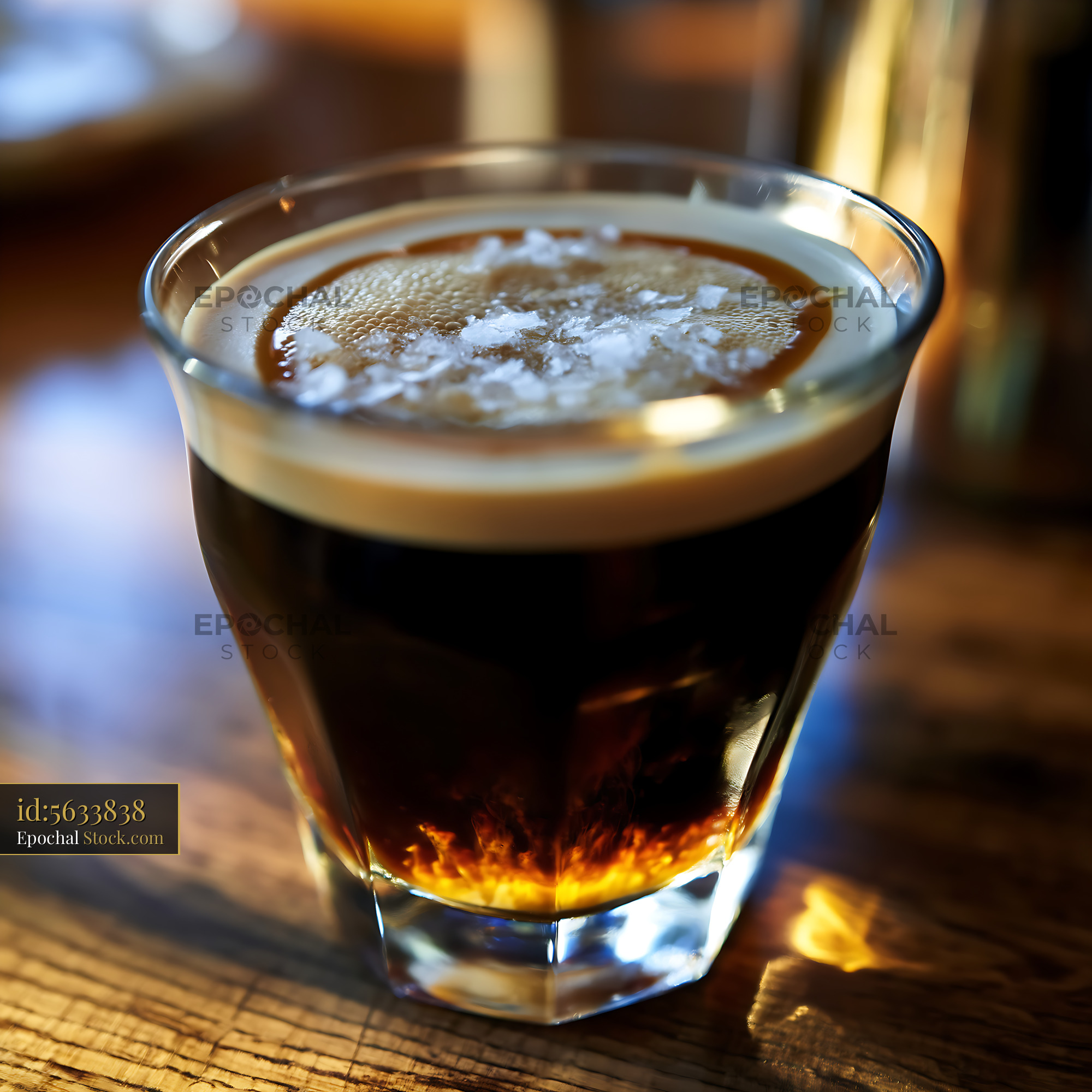 Nitro Caramel Coffee in Glass on Wooden Table - stock photo