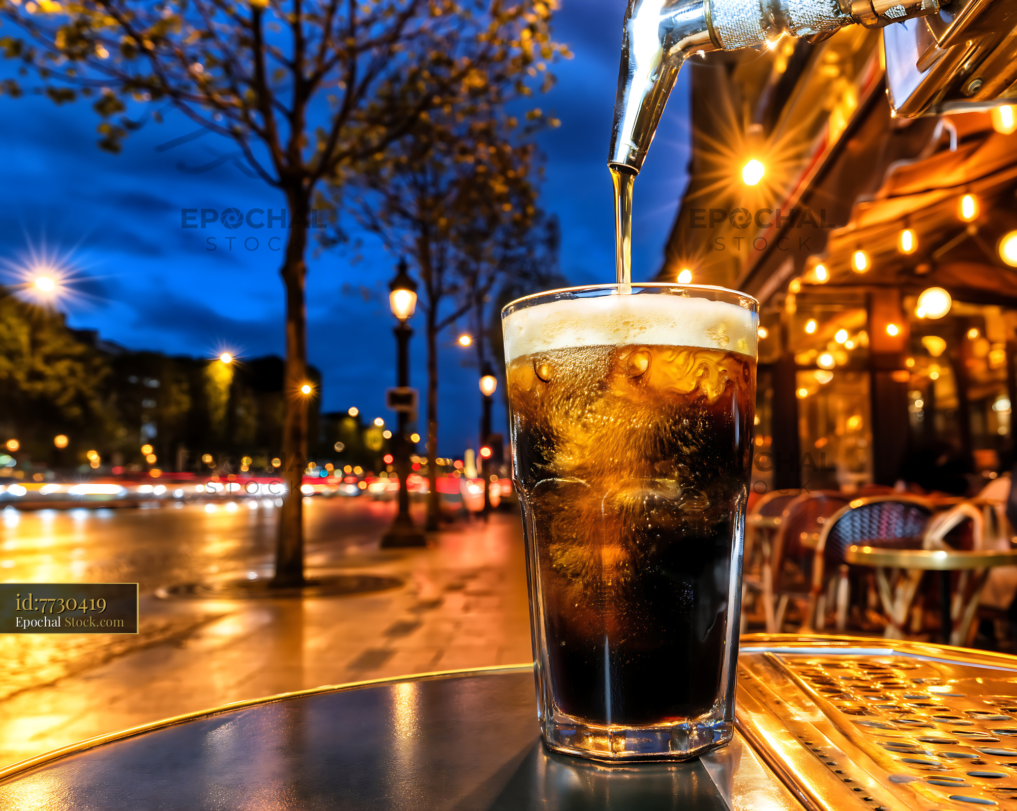 Nitro Caramel Coffee Pouring Into Glass at Night - stock photo