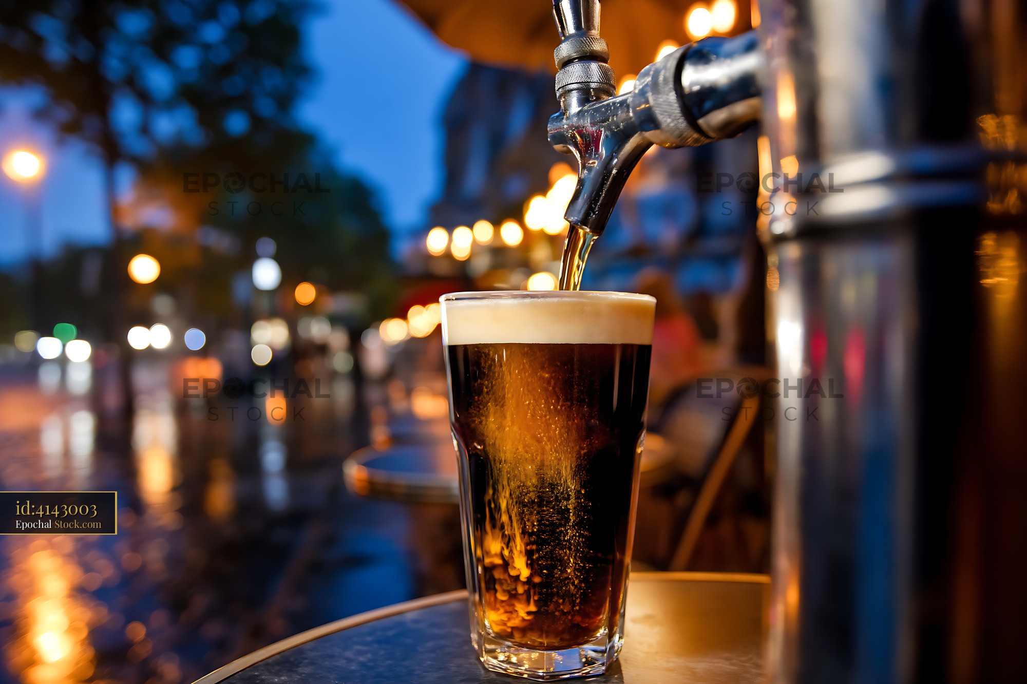 Nitro Caramel Coffee Pouring Into Glass at Dusk - stock photo