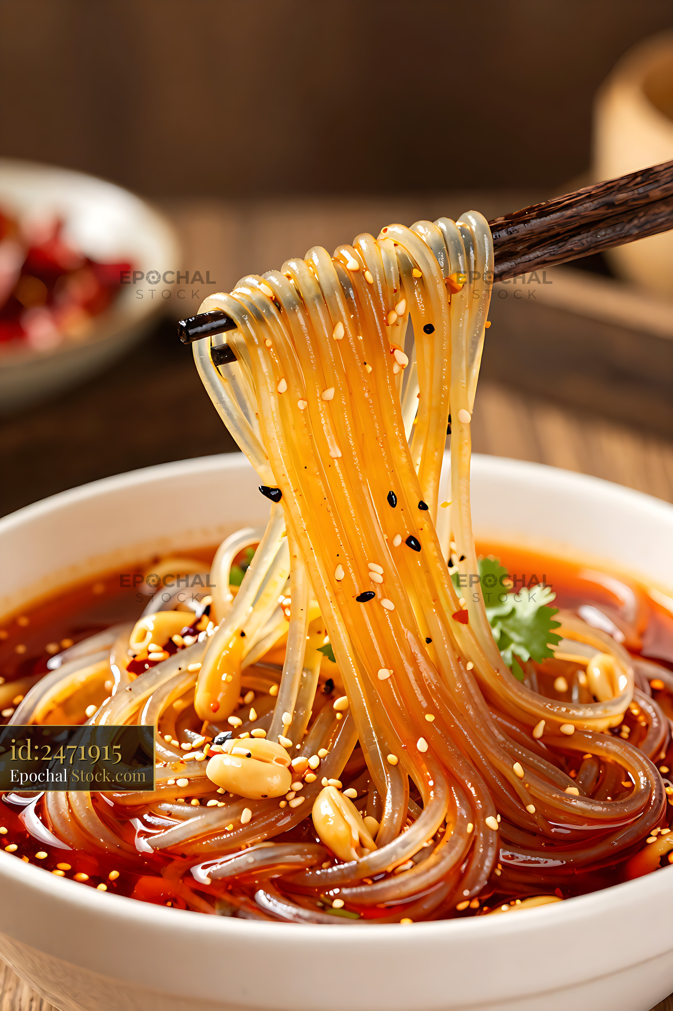 Sichuan Glass Noodle Salad Lifted with Chopsticks - stock photo
