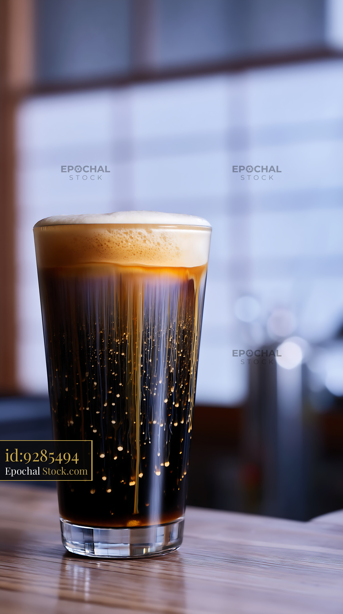 Nitro Caramel Coffee Glass on Urban Table - stock photo