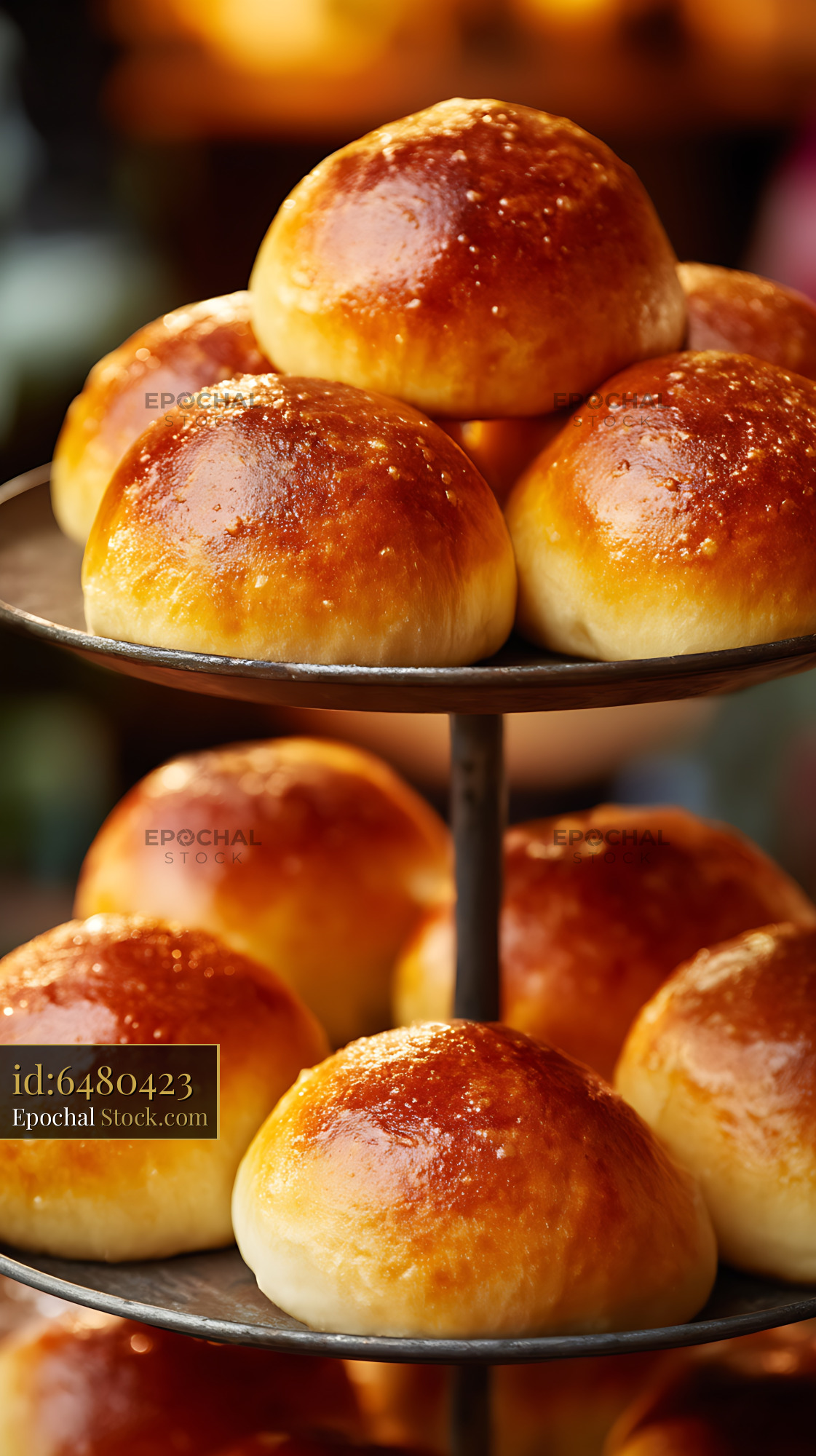 Golden Glazed Dinner Rolls on Tiered Stand - stock photo
