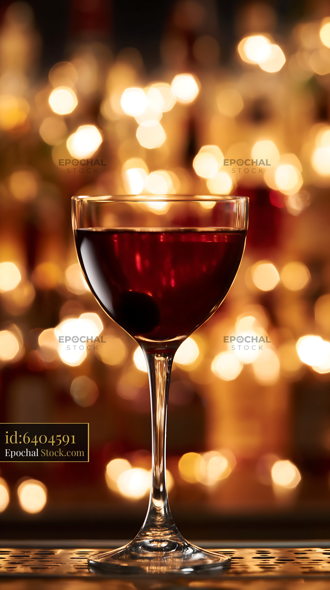 Red Bushwick Cocktail Against Golden Bokeh - stock photo