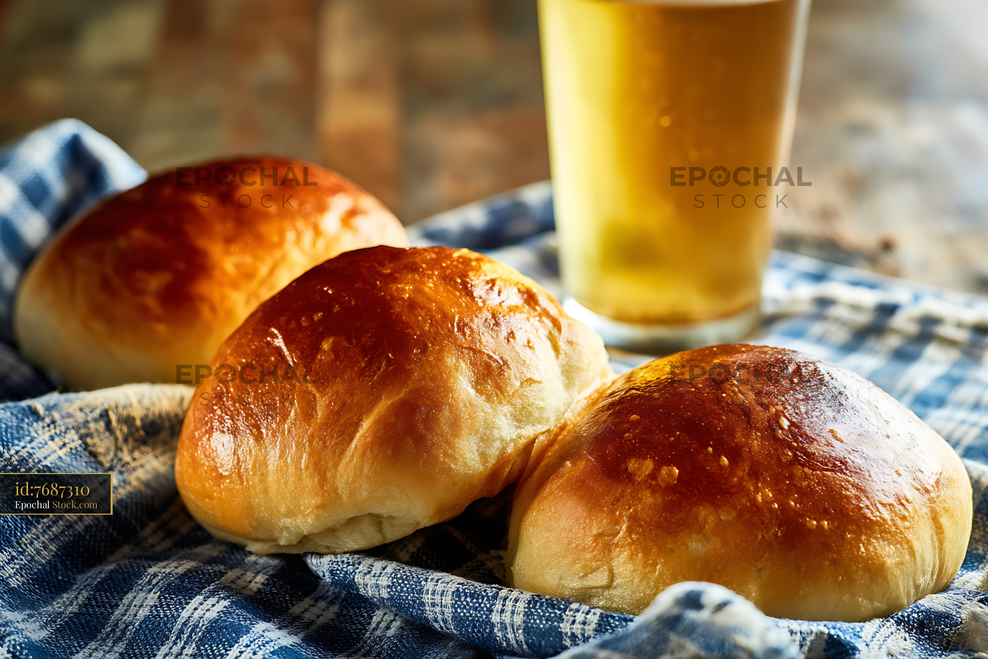 Golden Bread Rolls and Beer on Bavarian Cloth - stock photo