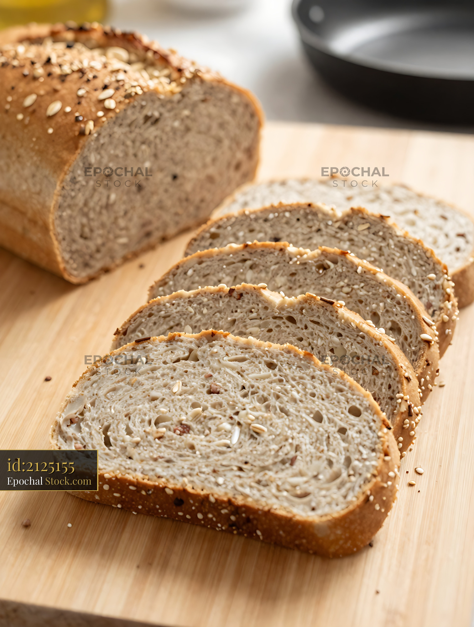 Whole Wheat Seeded Bread Sliced Wooden Board - stock photo