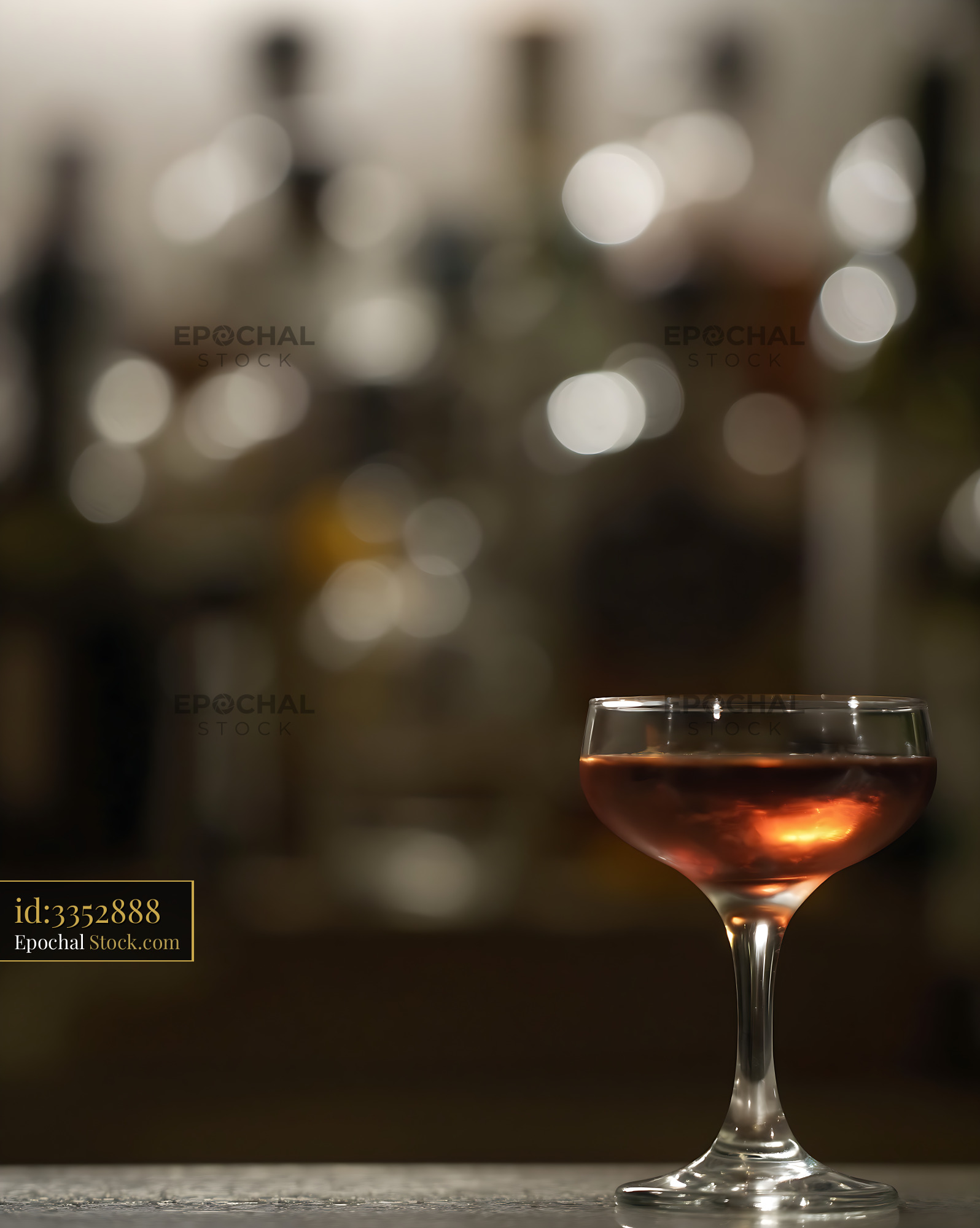 Bushwick Cocktail in Coupe Glass with Bokeh Lights - stock photo