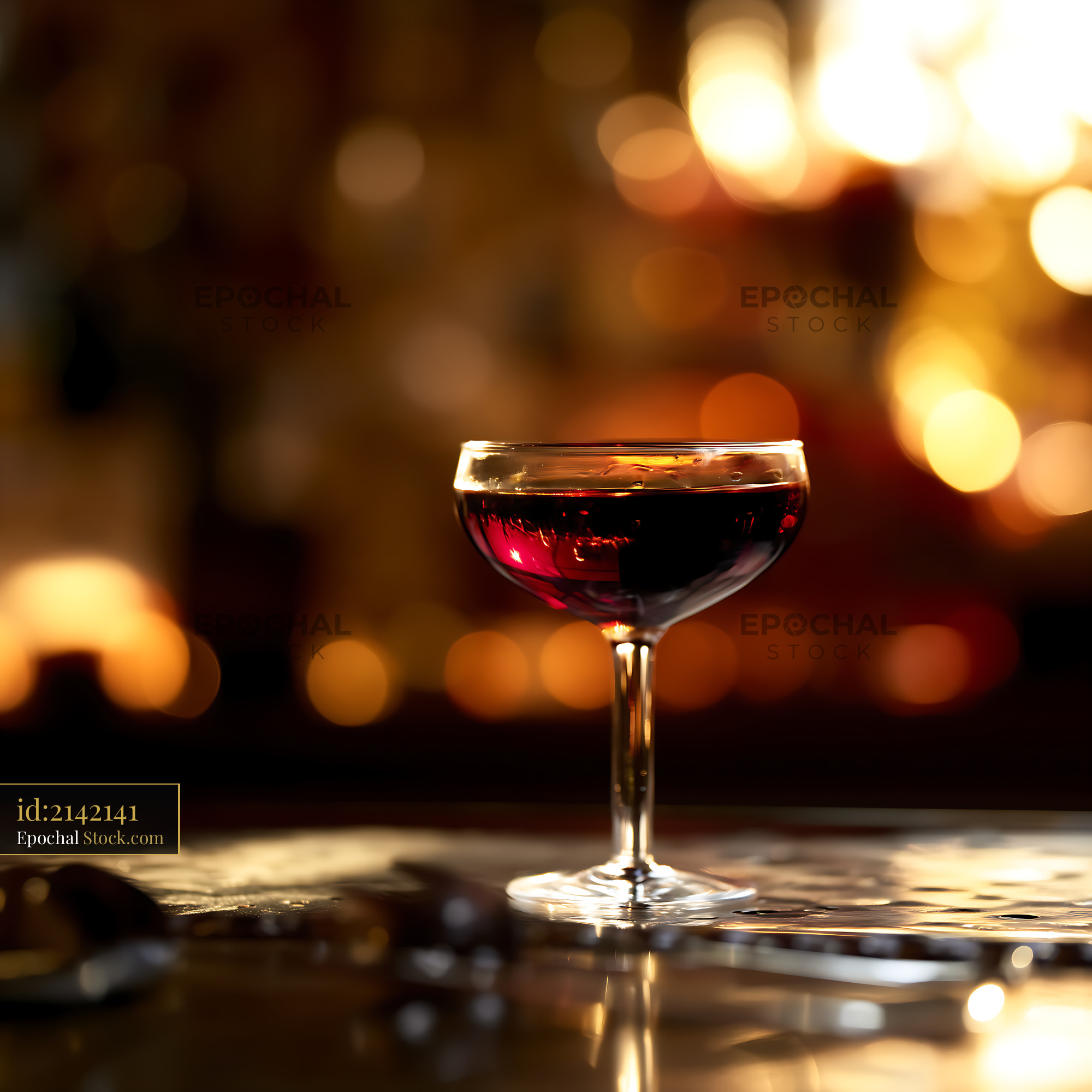 Bushwick Cocktail in Coupe Against Warm Bar Lights - stock photo