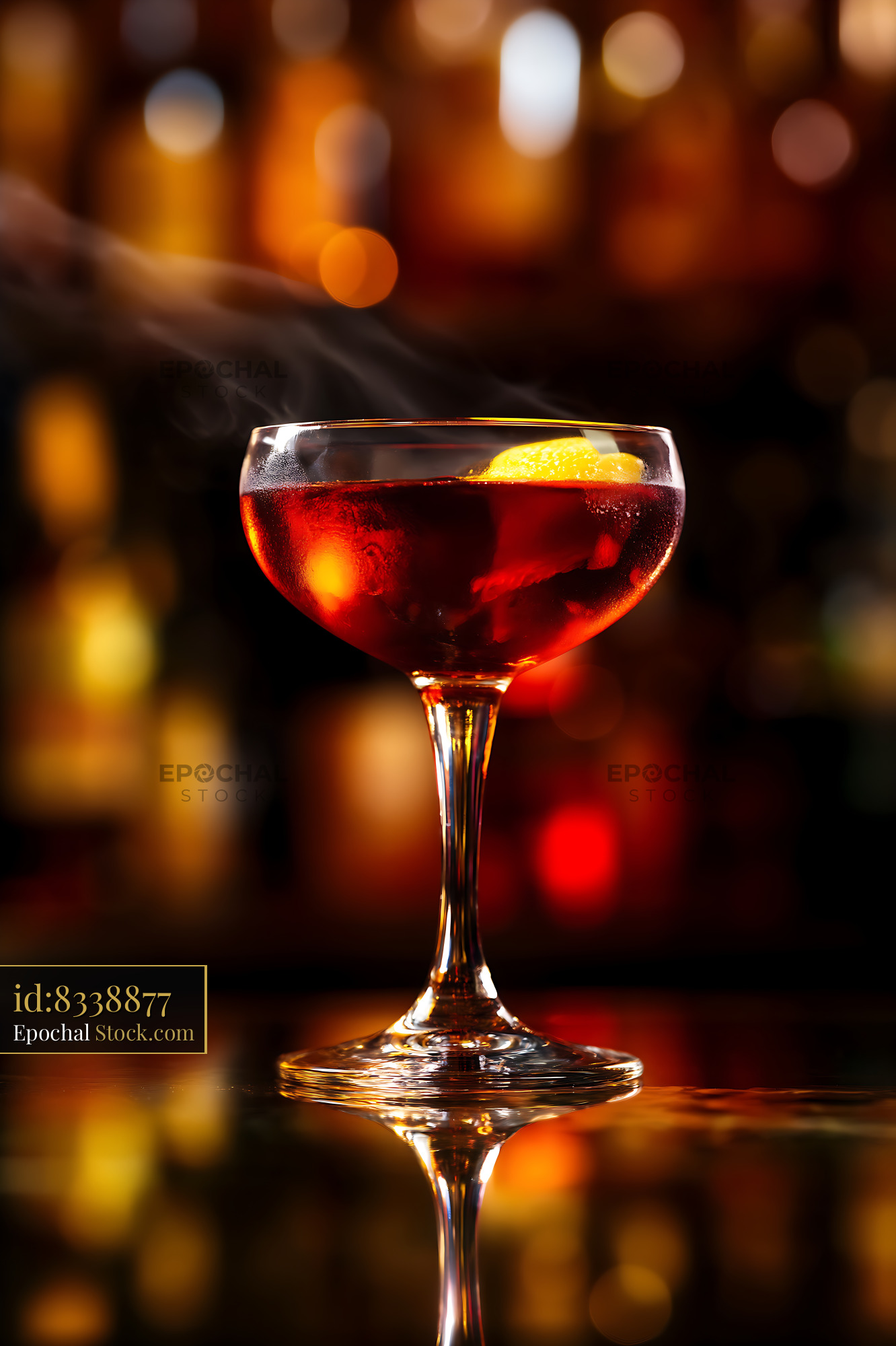 Bushwick Cocktail with Lemon Garnish on Blurred Bar - stock photo