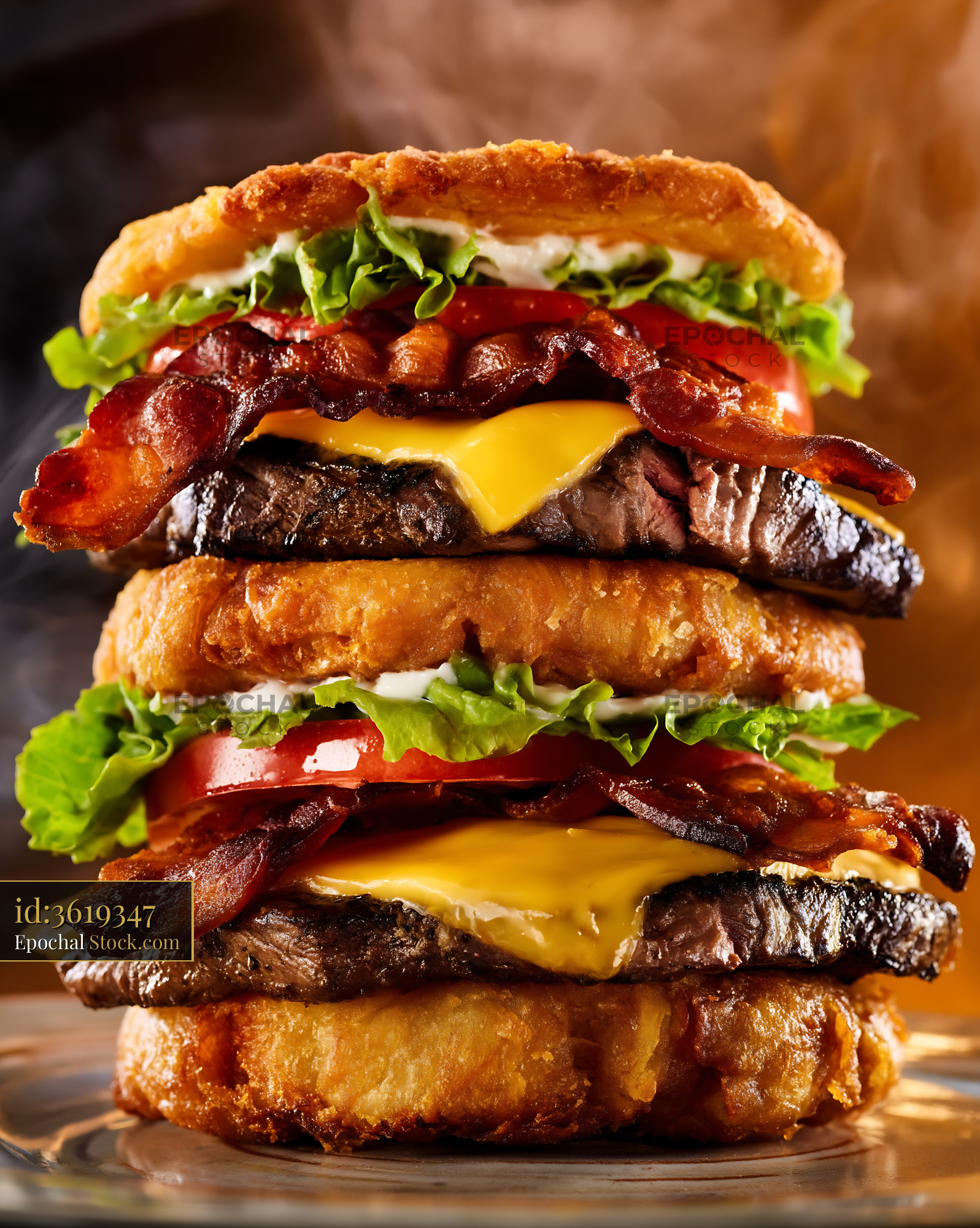 Double Bacon Cheeseburger Stacked on Golden Brioche - stock photo