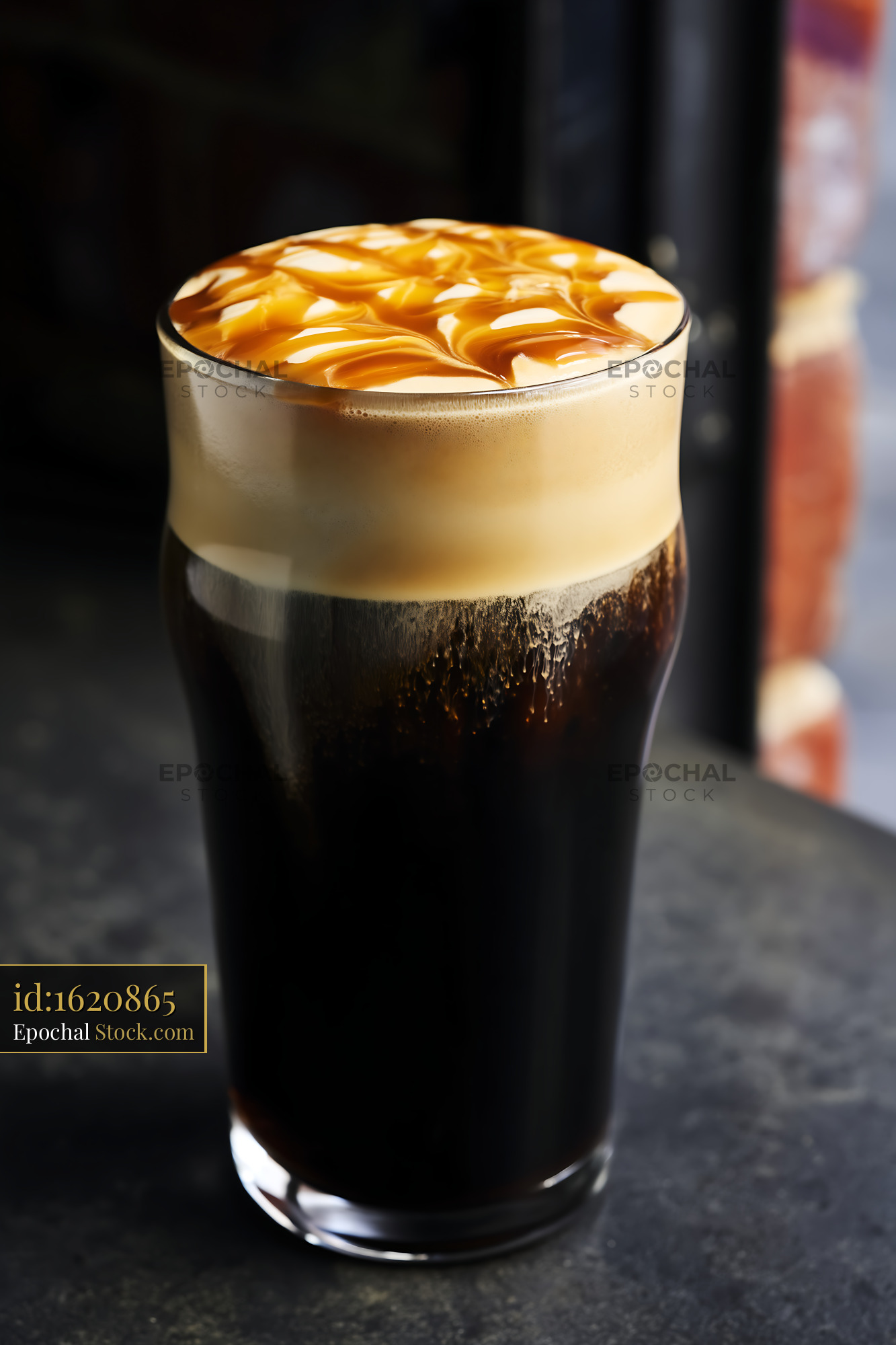 Iced Latte with Caramel Drizzle and Cream Foam - stock photo